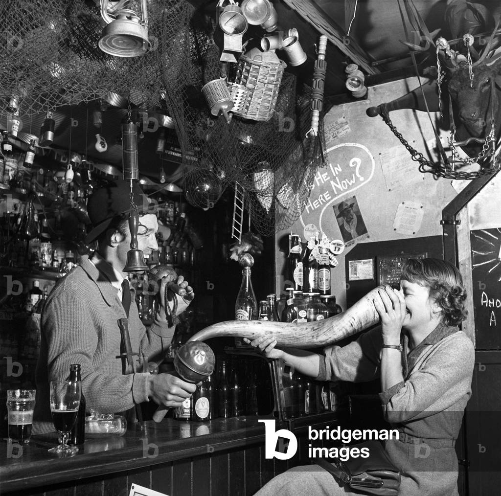 The customers of the Old Turkey Cock pub near Hunston in Herts, 1956 (b/w photo)