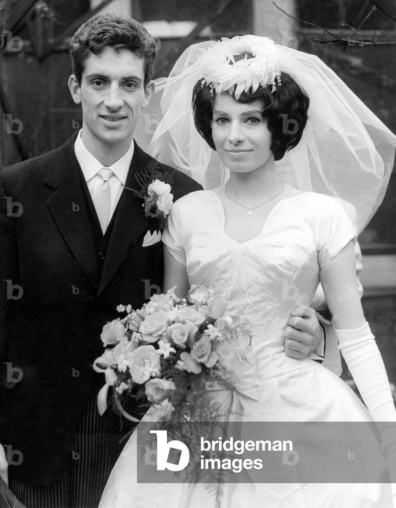 Sunderland Associated Football Club - Sunderland footballer Jimmy McNab and his bride Miss Sylvia Keeley, of Abingdon Street, Sunderland, after their wedding at St. Benet's Roman Catholic Church, Monkwearmouth, Sunderland. 12th May 1962 (photo)