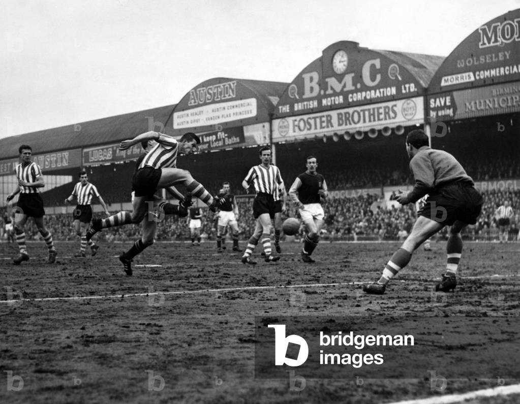 Division 1 match Aston Villa 0 -2 Sheffield Wednesday - A mighty kick and Wednesday left back Megson takes the ball off Dougan's toe at Villa Park this afternoon. 13th April 1963 (photo)