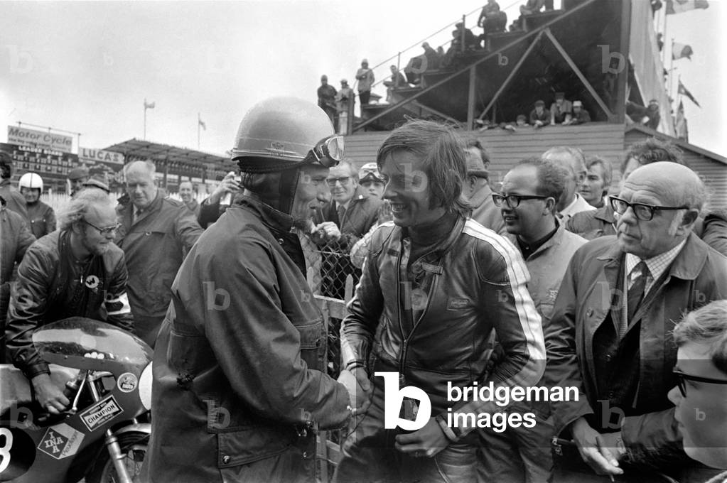 Action: Motorsport: Isle of man TT Races: Chas Mortimer, winner of the 125cc Lightweight races with a bottle of coke. June 1971