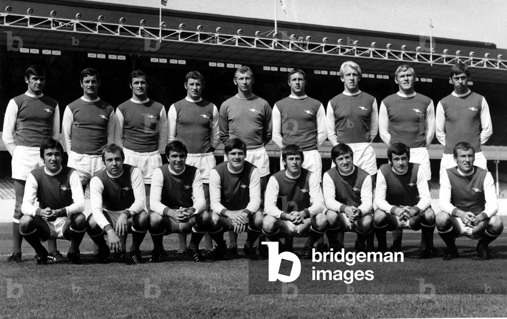 Sport - Football - Arsenal - Back Row - Left to Right - Peter Simpson, Frank McLintock, George Graham, Terry Neill, Bob Wilson, John Radford, Ian Ure, John Roberts, Charlie George. Front Row - Left to Right - Jon Sammels, David Court, Bobby Gould, Pat Rice, J. Robertson, George Armstrong, Peter Storey, Bob McNab. Date - 8th Aug 1969 (photo)