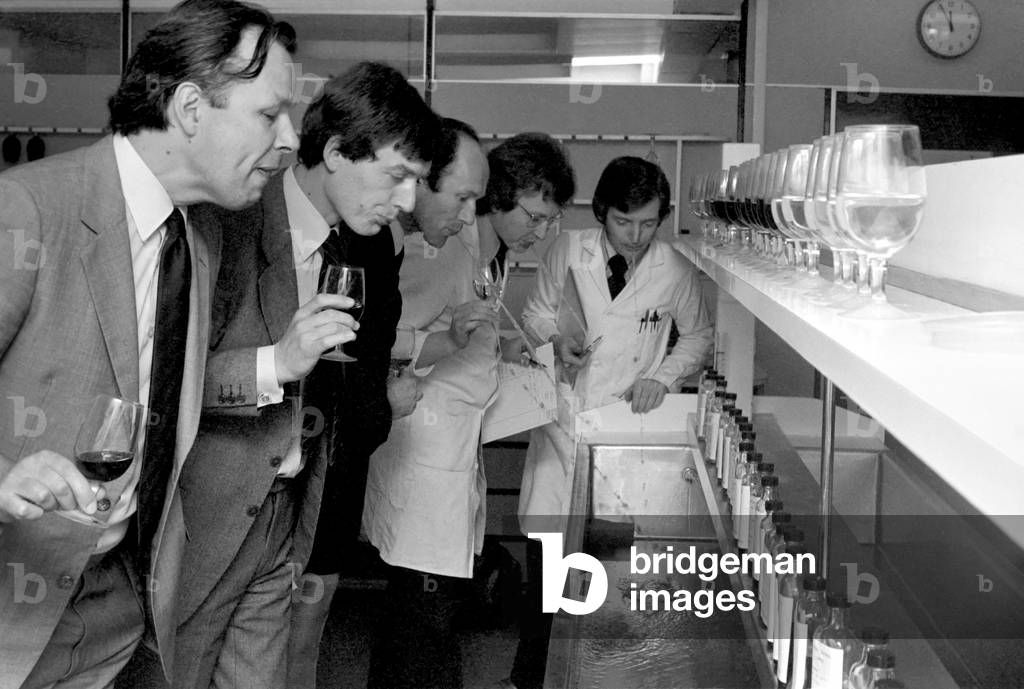 Wine Tasters sampling the latest consignment of red wine from the Beaujolais region of France April 1977 (b/w photo)