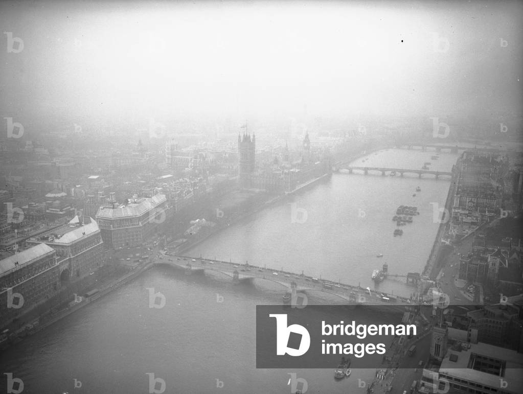 Aerial view of the River Thames, Big Ben, Westminster Palace, the bridges of Lambeth and Westminster and Thames House - the headquarters of MI5, c. 1935 (b/w photo)