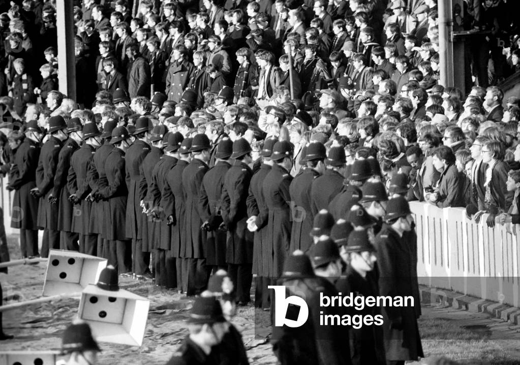 Anti-apartheid protestors, South Africa rugby team visit to Britain. Shoulder-to-shoulder Manchester and Salford police line up between the spectators and the game, November 1969