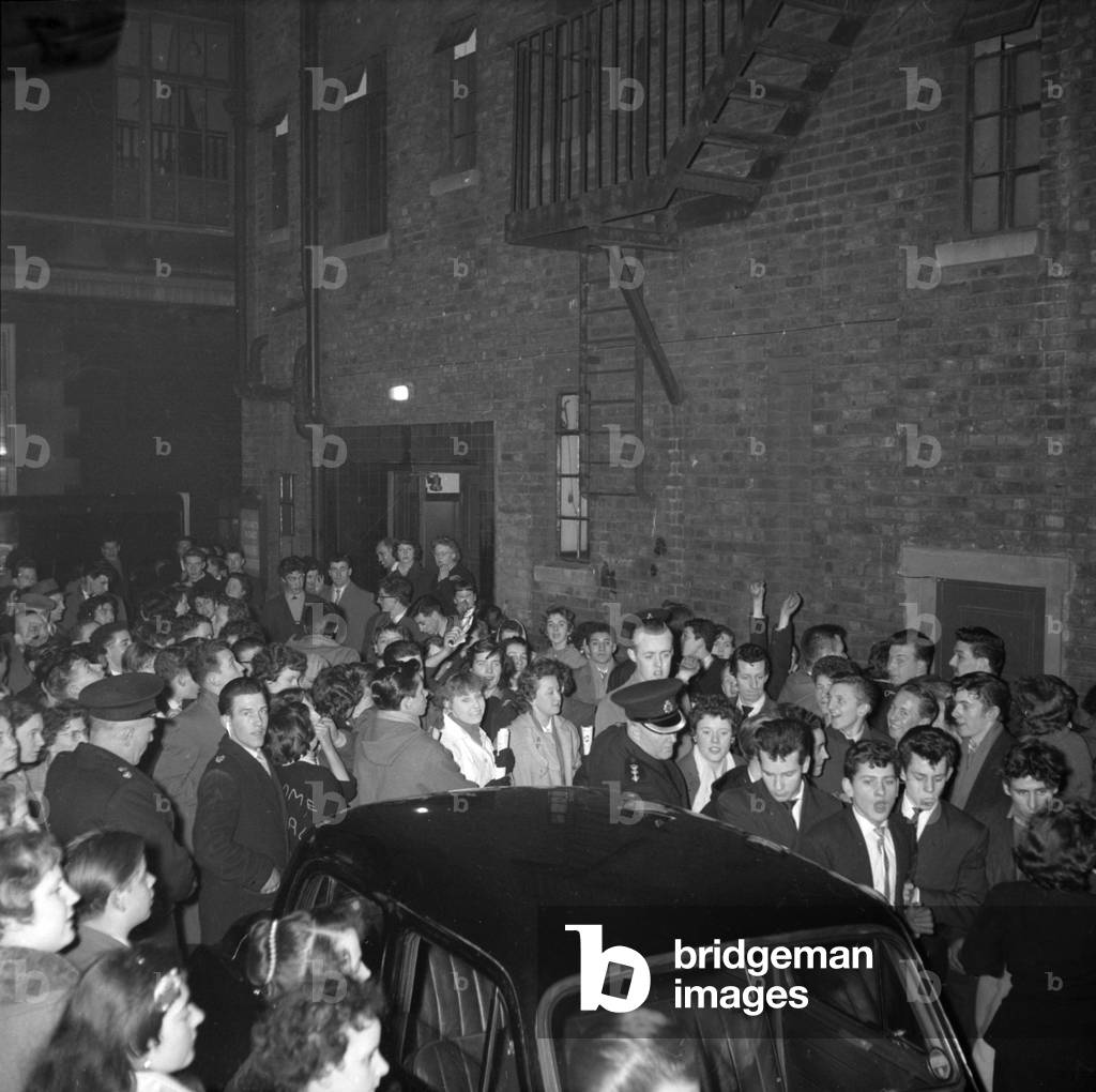 Bill Haley fans queuing up with police trying to keep control 7th February 1957 (b/w photo)