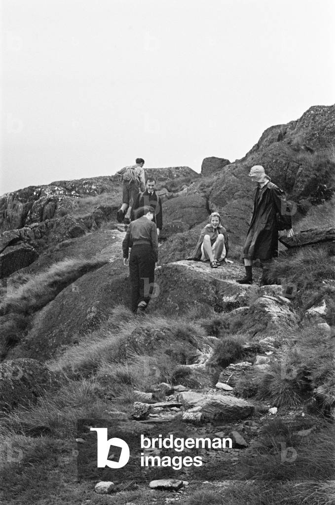 A group of people hill walking near Keswick, Cumbria, c. July 1947 (b/w photo)