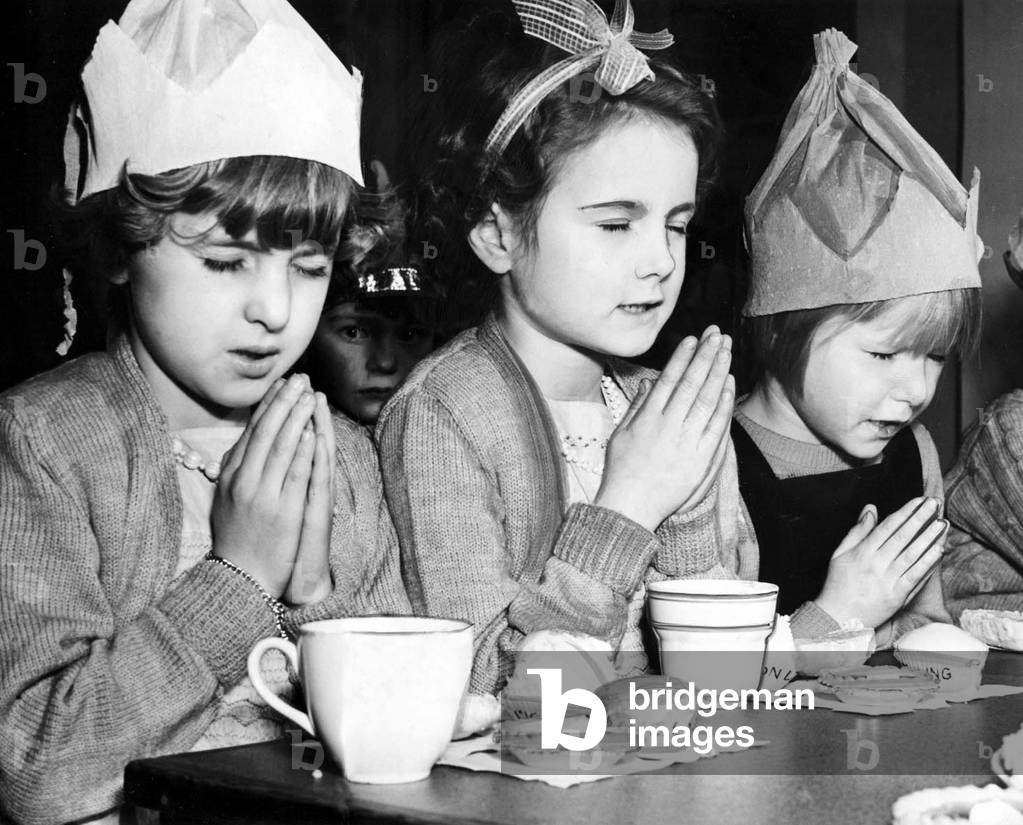 Pleased with the good things laid out for their Christmas party in King Edward Road School, 15th December 1971 (b/w photo)