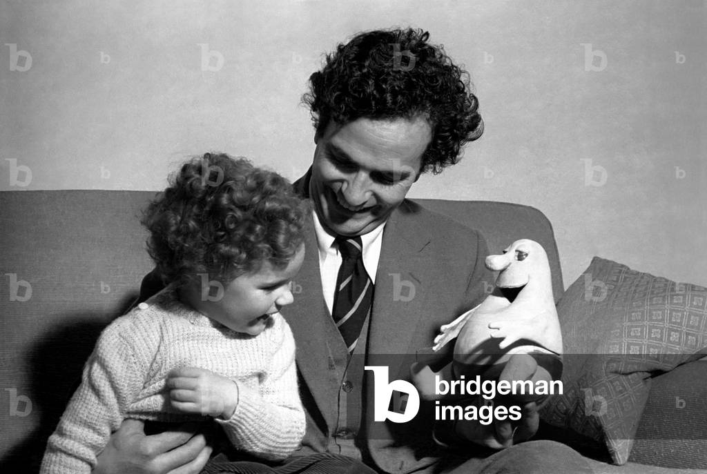 Comedian Michael Bentine seen here with a Bumble puppet and his son Gus. December 1953