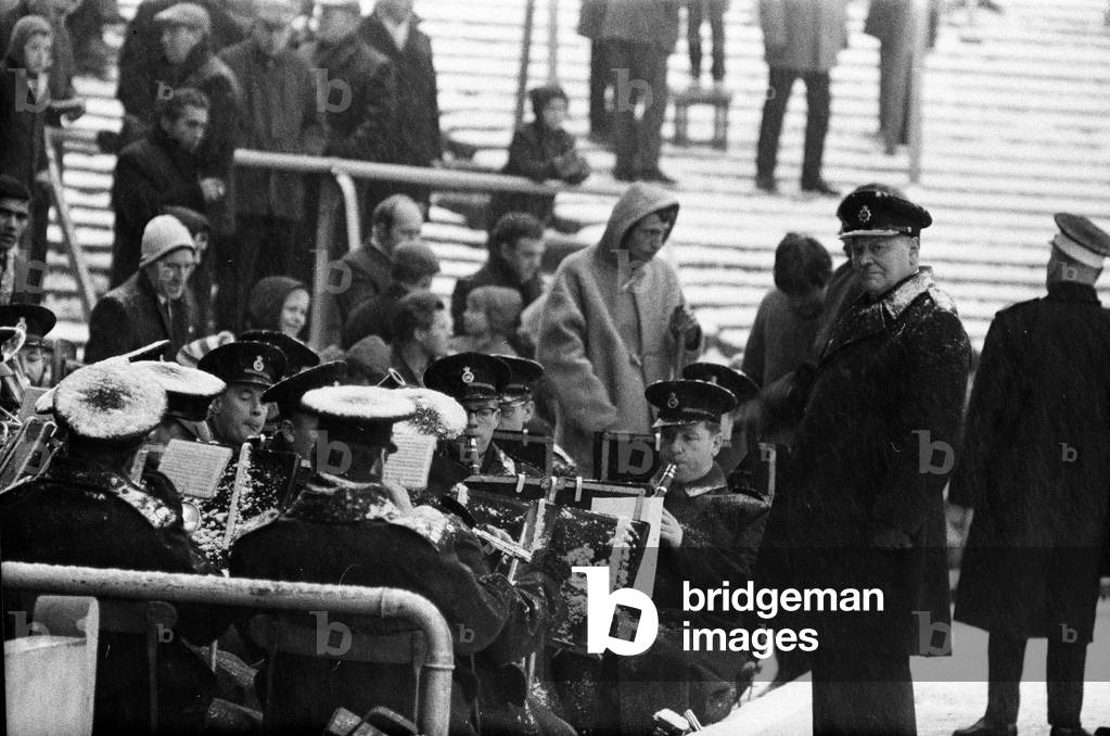 English League Division One match at Highbury, abandoned due to heavy snow. Arsenal v Sheffield Wednesday. The police band plays on even though the music is obscured. 9th December 1967 (photo)