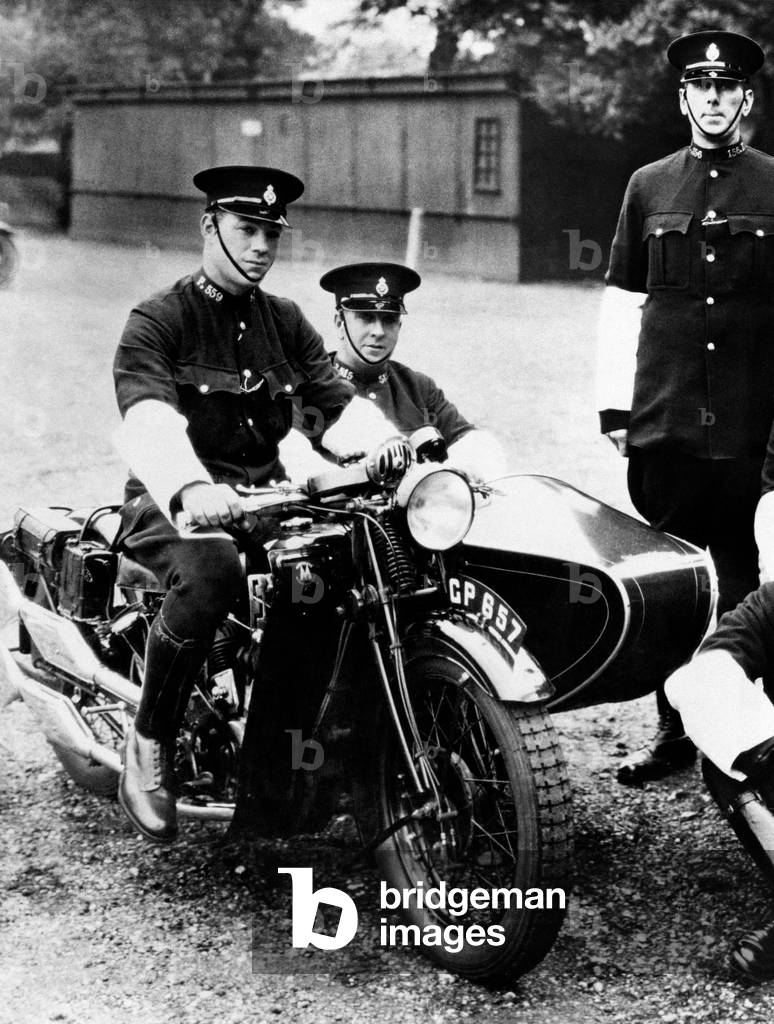PC George William Allen 27 (left) and PC Harry Cautherley 28 (centre), pictured on a interlocked police motorcycle combination, c. 1930 (b/w photo)