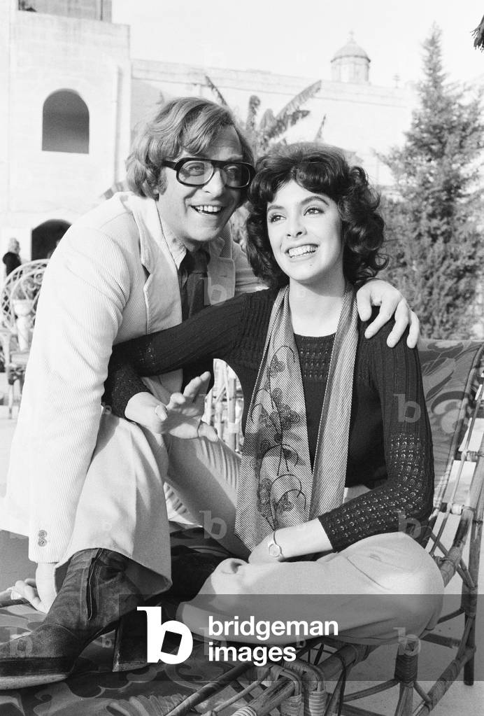 Actor Michael Caine with Nadia Cassini on the set of their new film Pulp during filming in Malta, 17th, January 1972 (b/w photo)