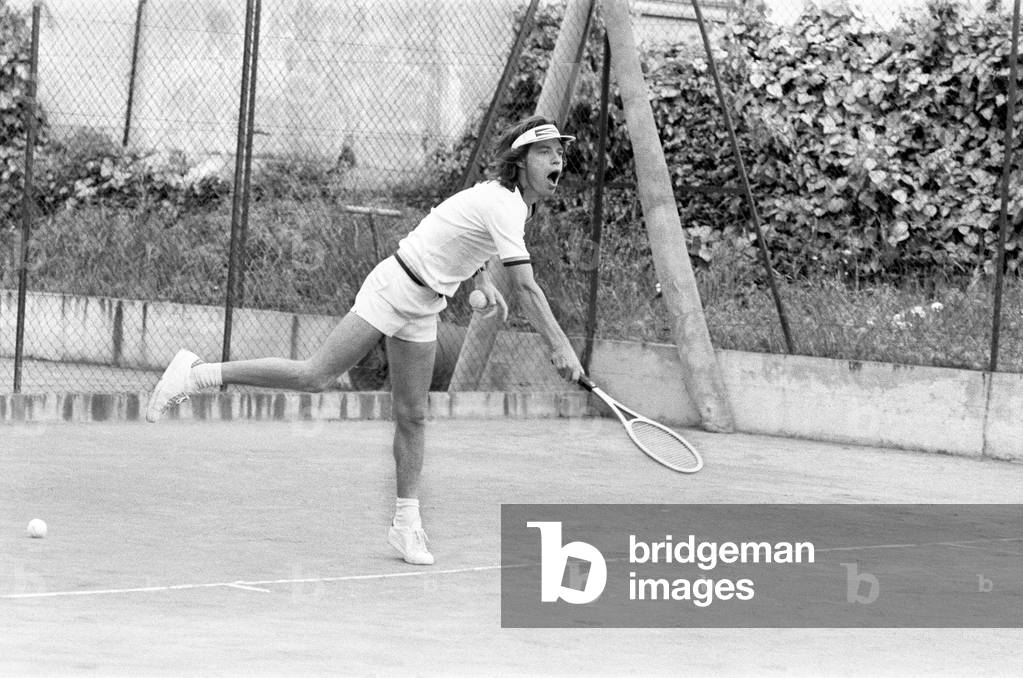 Mick Jagger takes time out to relax in the South of France by playing tennis with fellow band member Ronnie Wood before the start of The Rolling Stones European Tour, (starts Frankfurt on 28th April). Pictured Saturday 22nd April 1976 (b/w photo)
