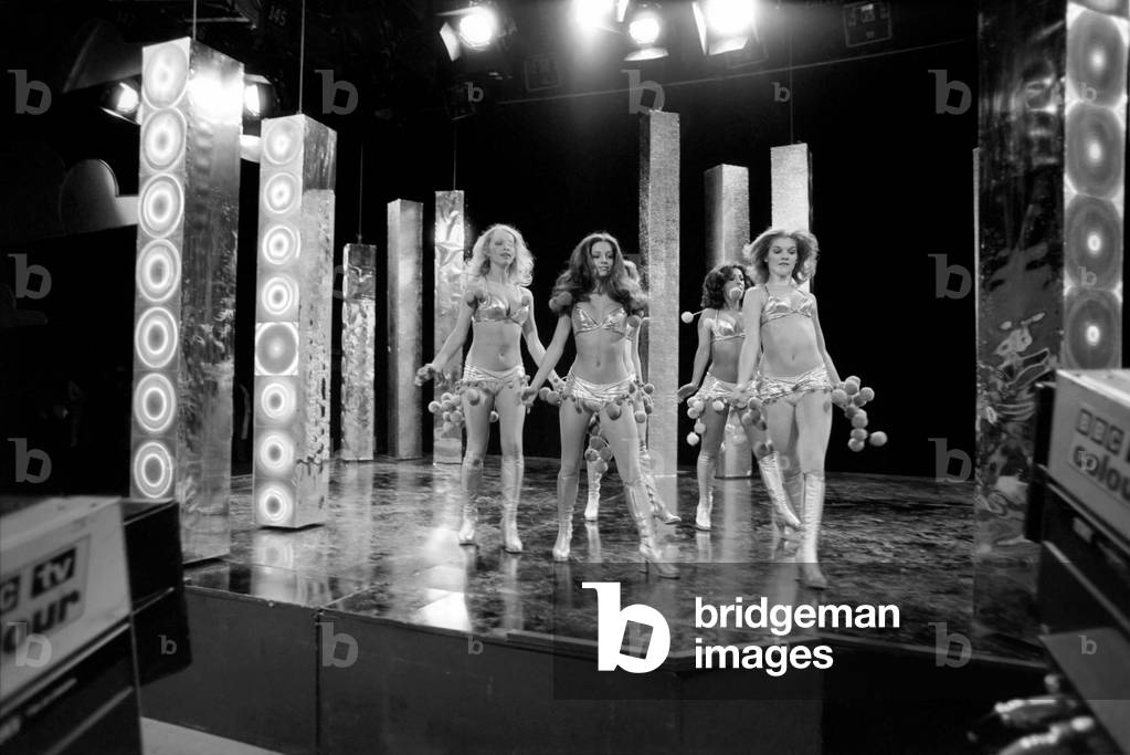 Scenes at BBC studios during the filming of the music television programme Top of the Pops Pans people go through their weekly routine of dancing to a hit record, 17th April 1975 (b/w photo)