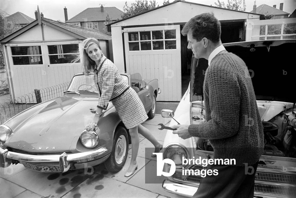 Models pose for a Lolly Dolly wives feature in Manchester. Man and woman and child in a suburban neighbourhood. November 1969