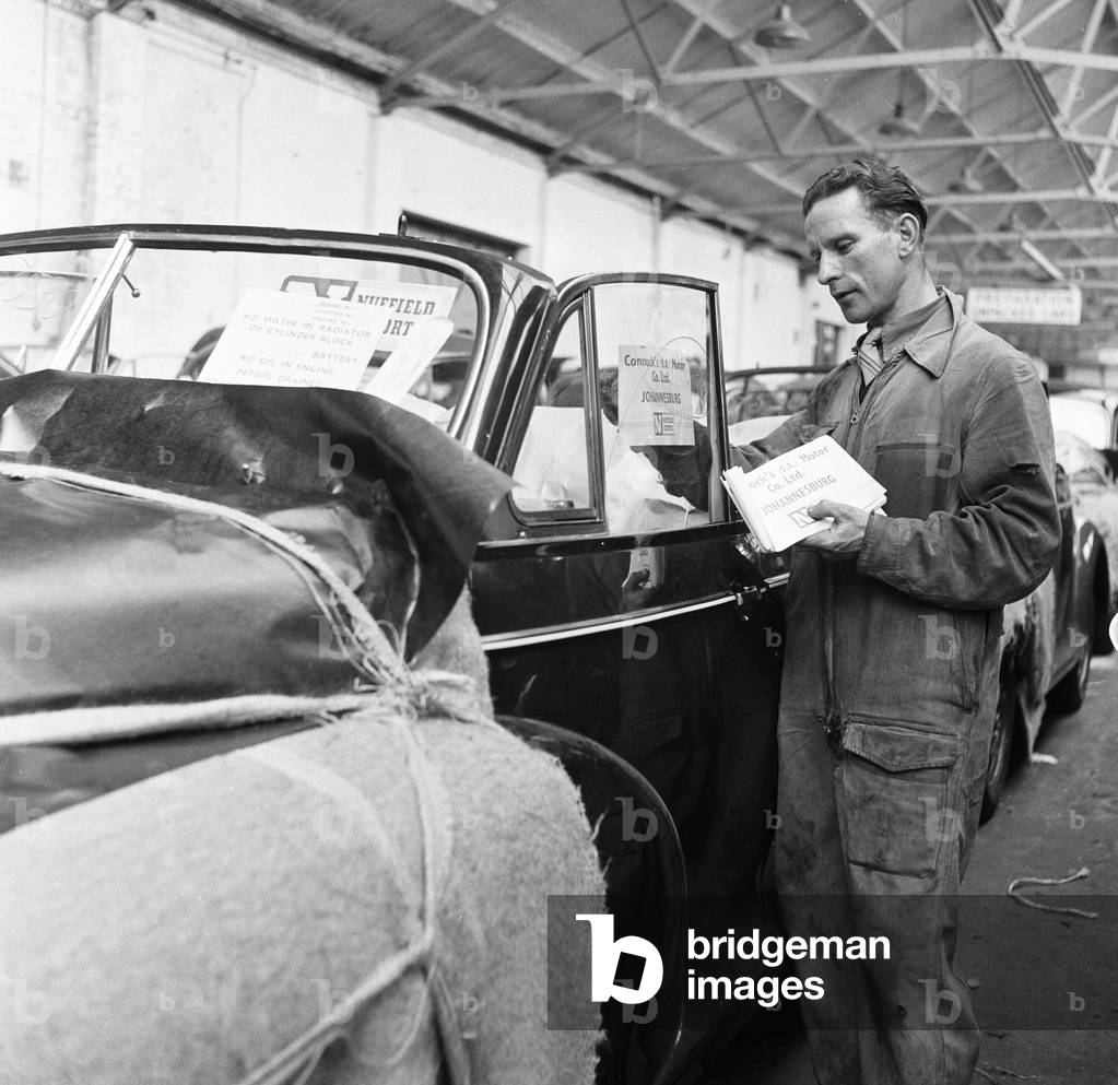 Morris Minor Low Light Sedans fresh of the production line after being packed for export to South Africa at Morris's Cowley factory 24th March 1949 (b/w photo)