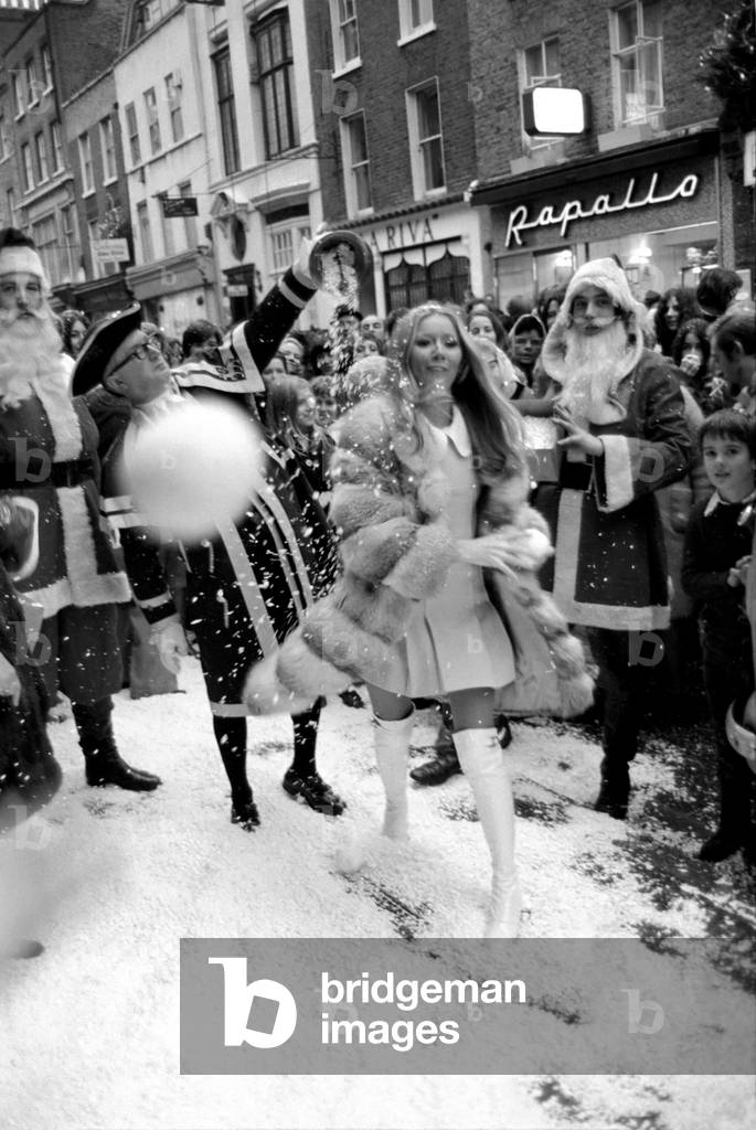 Festive Scenes. In South Molton street, Mayfair, it was snowing but it was only plastic snow that was falling. Singer Clodagh Rogers was present with Father and Mother Christmas, to open the street's Christmas display of lights. Clodagh Rogers throws a snowball. December 1969 Z11515-002