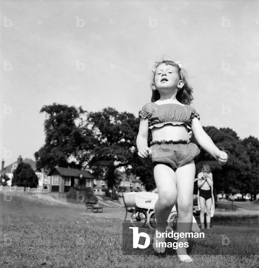 Holidays, little girl modelling swimsuit. June 1953 D3299-010