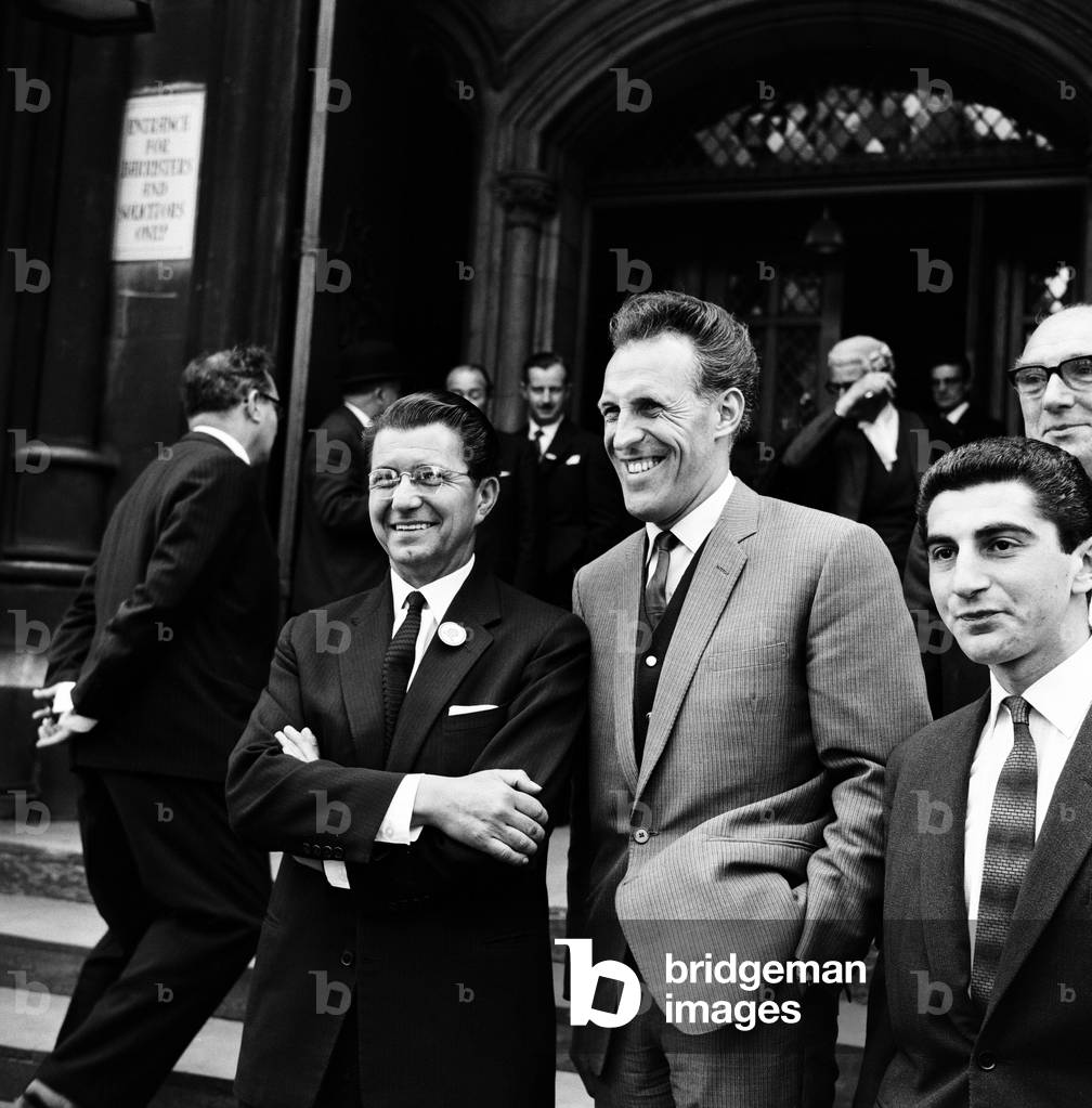 Television presenter Bruce Forsyth outside the High Court after coming to an agreement with his agent Miff Ferrie (left). 5th June 1962 (b/w photo)