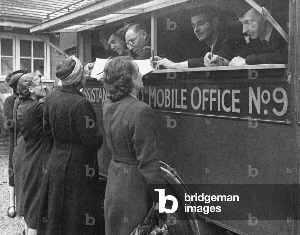 Mobile Assistance Board Office in action in Streatham High Road, London.
19th July 1944
