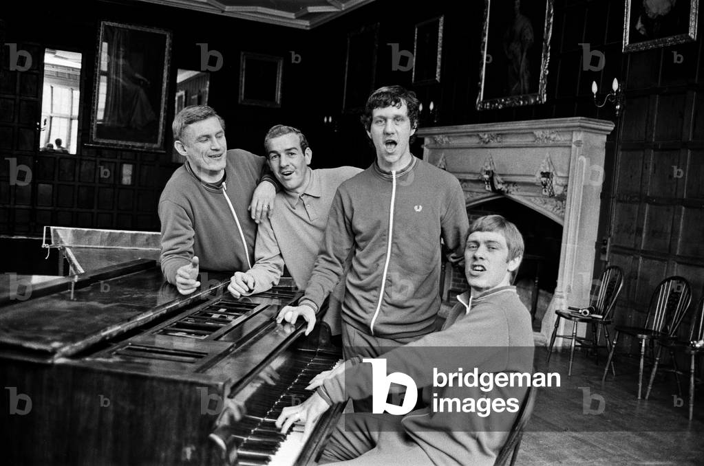 Leicester City team training ahead of the 1969 FA Cup Final. Captain David Nish on piano sings a song accompanied by a chorus of left to right: John Sjoberg, Alan Woollett and Malcolm Manley. 24th April 1969 (photo)