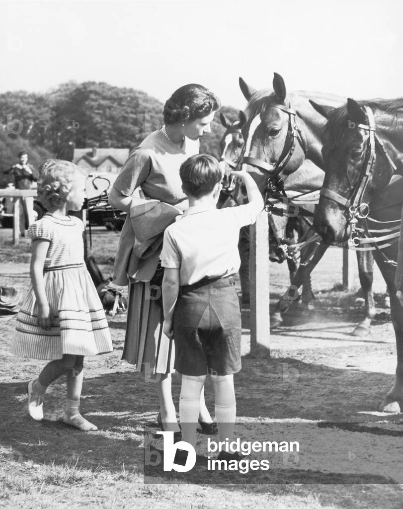 The Queen, Prince Charles and Princess Anne at the Royal Windsor Horse Show.
May 1956.