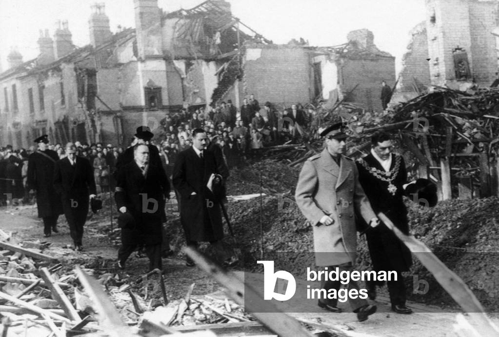 King George VI visits the bomb damaged city of Birmingham following an air raid, December 1940 (b/w photo)