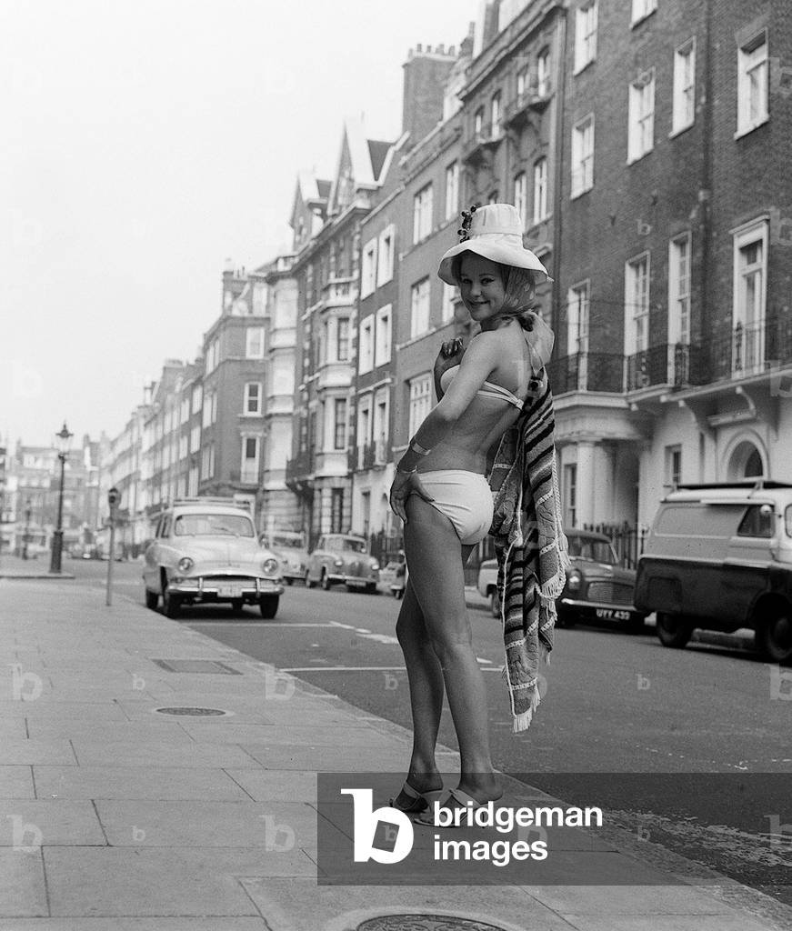Judy Edwards (16) rehearses for the end of term fashion show at The Charm Show, October 1961 (b/w photo)