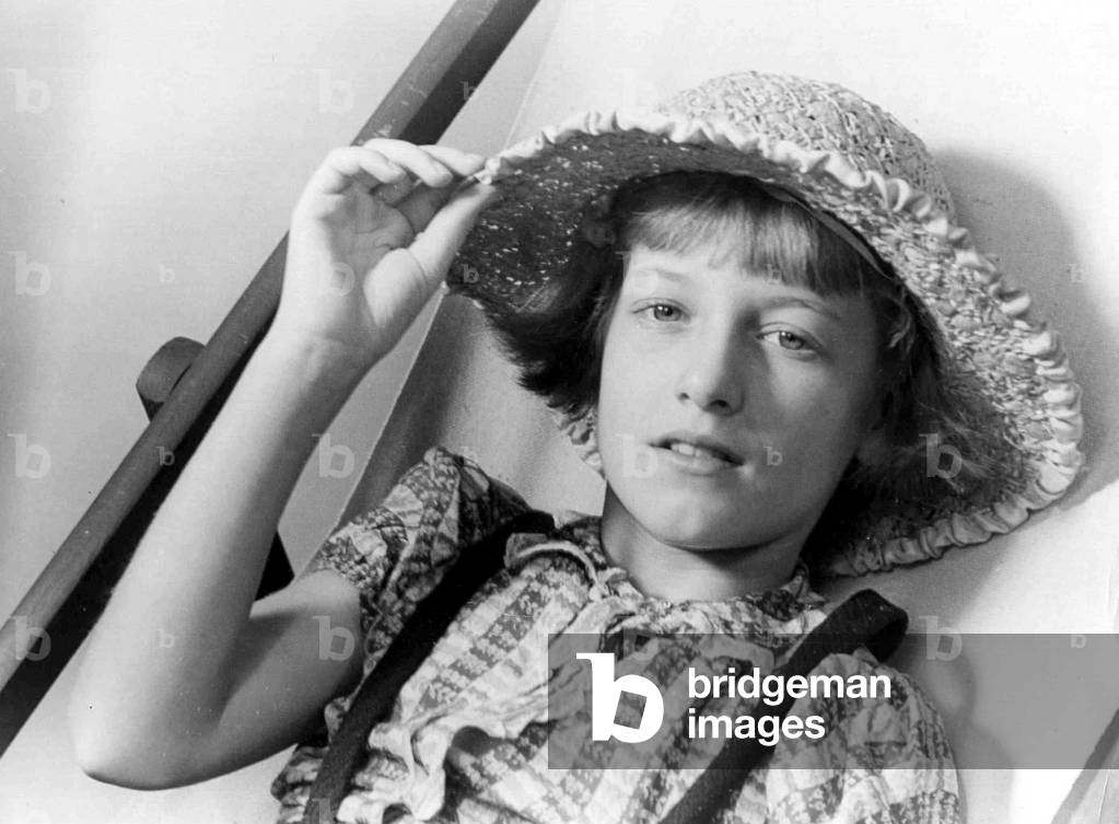 Young girl wearing straw hat 
Circa 1945