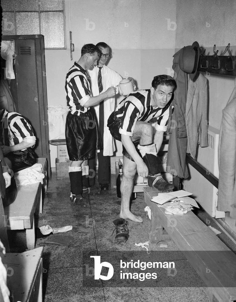 1952 FA Cup Final at Wembley Stadium. Newcastle United 1 v Arsenal 0. Newcastle's goal hero George Robledo celebrates in the dressing room after the match. 3rd May 1952. Another big signing was Chilean striker George Robledo, who arrived at Gallowgate along with his brother Ted as Newcastle began to challenge for the First Division title. George became a feared striker and immensely popular on Tyneside, scoring almost 100 goals before returning to South America in 1953. Another talented import - this time from nearer to home, in Northern Ireland - full-back Alf McMichael is in the background getting a top-up (photo)