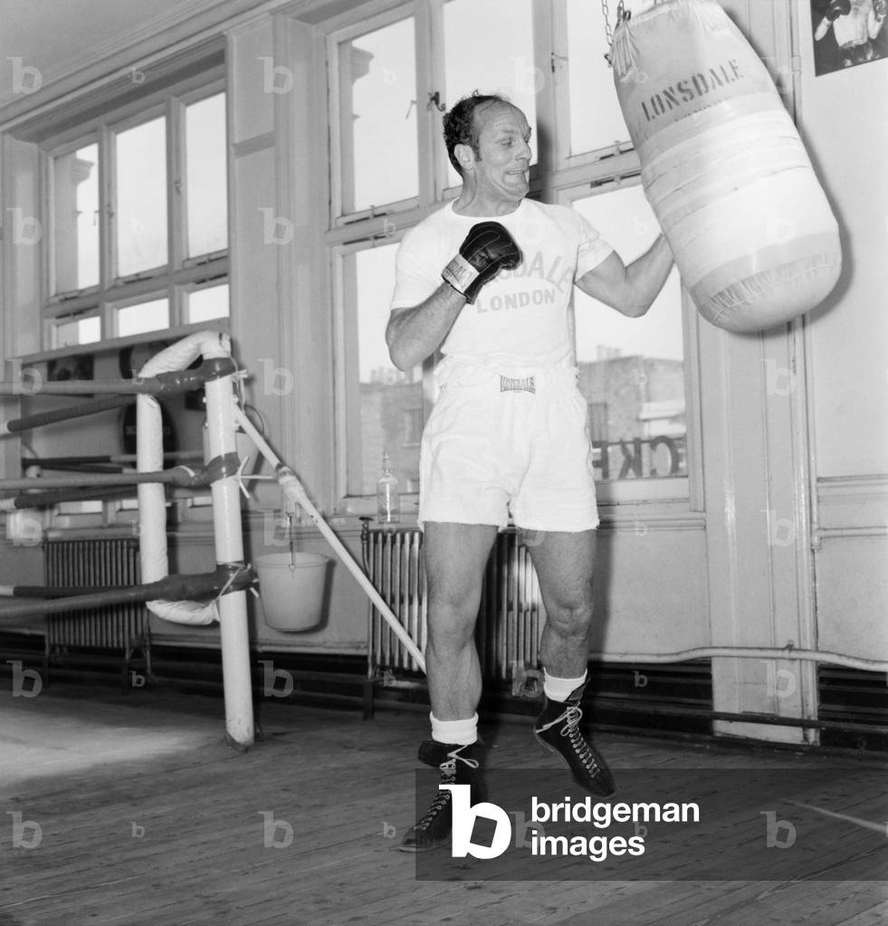Former British Heavywight Boxing Champion Henry Cooper today had his first gym work-out since his cartilage operation at the Thomas A Beckett Gymnasium in the Old Kent Road. Henry plans to make his comeback to the ring at the Wembley Pool in March. He has been doing exercises at Arsenal to build up his knee which he injured when training for a fight