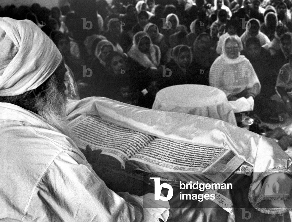 Religion: Reading for World Peace. Saint Priti Paul Singh Sayyad of Patiala, India, reads the Sikh Bible to a gathering at the Sikh Church, in Southall, Middlesex. March 1967