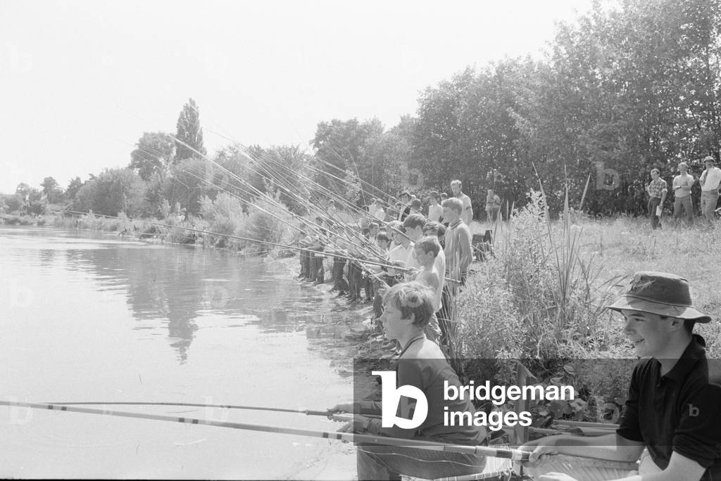 Look out fish! A group of boys aged between ten and fourteen years seen here at Wraysbury, Buckinghamshire being taught how to fish . It was part of an event organised by the London and South Eastern Tackle Dealer to show the youngsters some of the intricacies of freshwater fishing. 13th July 1970