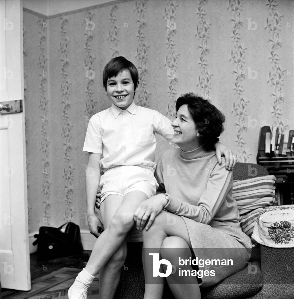 A woman and her boy at home. November 1969