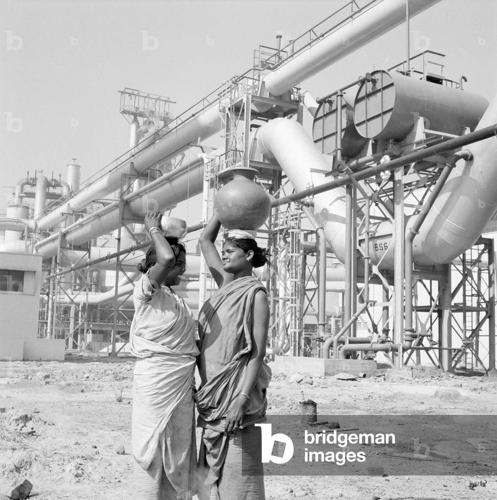Women water carriers seen here at the Durgapur steel works in West Bengal, India, February 1961 (b/w photo)