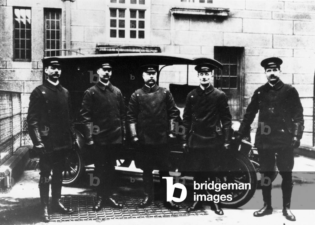 A group of mobile police officers with a police van 1910 - 1920 circa