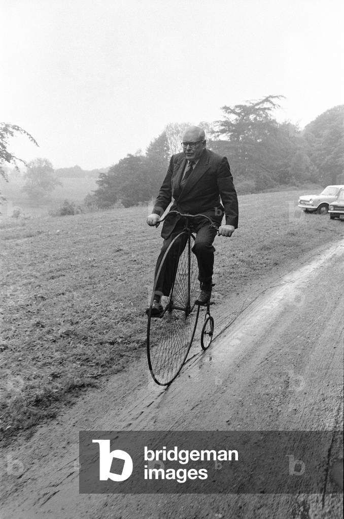 Mr Philip Yorke takes a trip around the grounds of his house on a Penny Farthing. He has been trying to give away his family home for five years, and now the National Trust has decided to take the house, full of priceless treasures, including the Penny Farthing, Erdigg Hall, Wrexham, North Wales, 29th May 1973 (b/w photo)