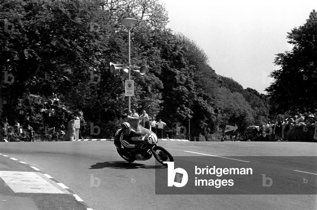 Sport Motorcycling: Isle of Man TT Racing 350 CC Class Junior. Brian Steenson on his way to second place. June 1969