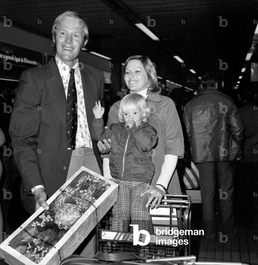Cricketer Tony Greig and family seen here arriving at Heathrow Airport April 1975 (b/w photo)