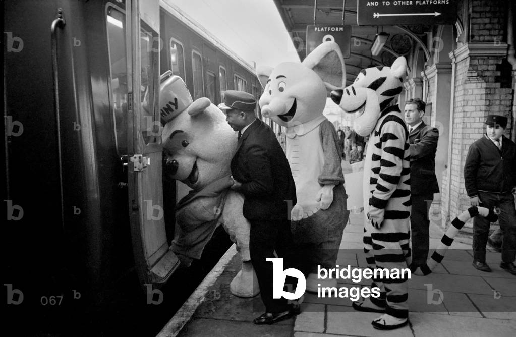 Entertainment Television Cartoons Humour. Walt Disney characters who are travelling round the country, today left their van at Watford Junction and travelled to Euston by train. As Winnie the Pooh was too fat to enter the normal passenger carriage, they has to make the journey in the guards van. On arrival at Euston they were met by the station manager's shorthand typists, 19 year old twins, Diana and her sister Susan Wheatley,