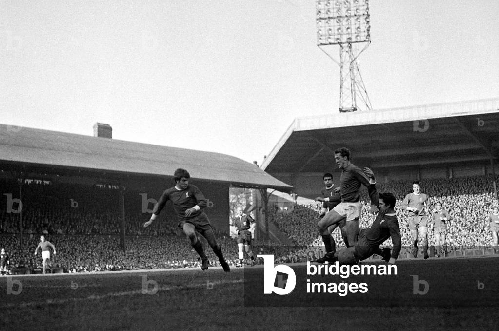 Manchester United goalkeeper Alex Stepney charges through the challenges of Liverpool's Ron Yeats (left) and Lawler during their league match at AnfieldOctober 1968 (photo)