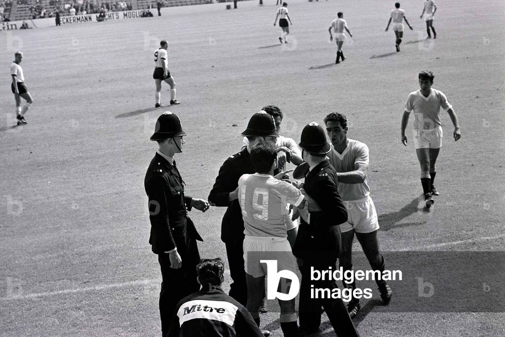 World Cup Football 1966West Germany v UruguayReferee Jim Finney calls for police assistance after Hector Silva refuses to leave the pitch after being ordered off for a foul on Germany's Helmut Haller©Mirrorpix1960s (photo)
