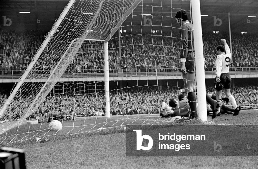 Derby v. Liverpool. O'Hare arms paised Hector and Tommy Lawrence on floor. November 1969 (photo)