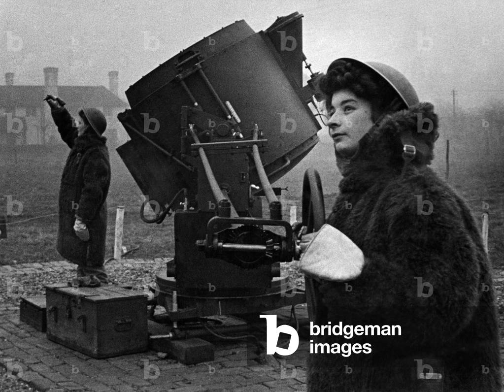 ATS girl on the searchlights seen here wearing for coats. March 1943