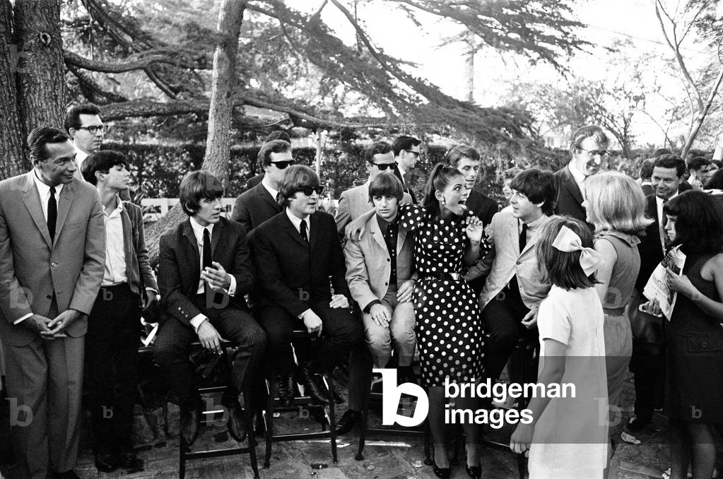 The Beatles at a Hollywood garden party on their American Tour. Circa 27th August 1964 (b/w photo)