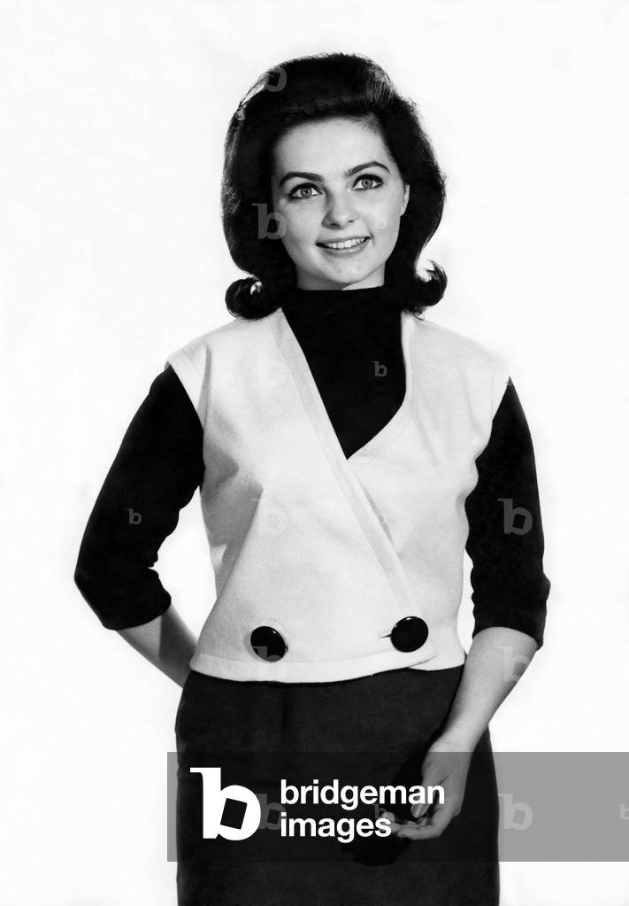 Reveille Fashions 1964. Margaret Reed modelling a tailored waistcoat. October 1964 (b/w photo)
