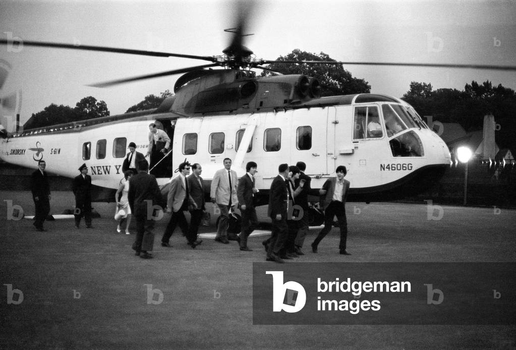 The Beatles 1964 American Tour Indianapolis, Indiana. The Beatles disembark from their helicopter after touching down. 3rd September 1964 (b/w photo)