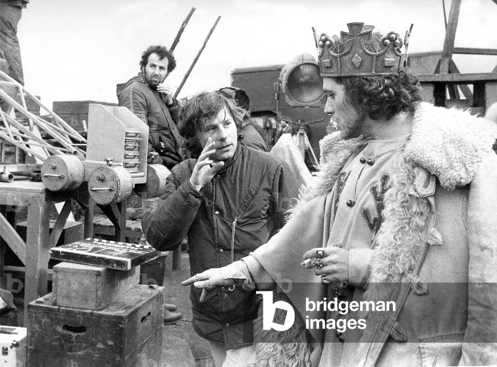 Film director Roman Polanski talks with actor Jon Finch who plays MacBeth in 1979 (b/w photo)