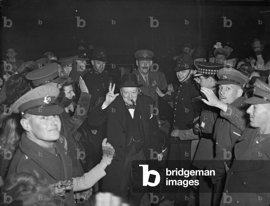 Former Prime Minister and leader of the Tory party seen here greeting the crowd outside the Royal Albert Hall with his famous two finger v for victory salute. Mr Churchill was attending a 8th Army re-union, 23rd October 1946