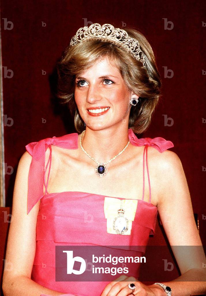 Princess Diana in Australia at the State Reception at Brisbane wearing a pink dress and tiara and sapphire engagement ring. April 1983
