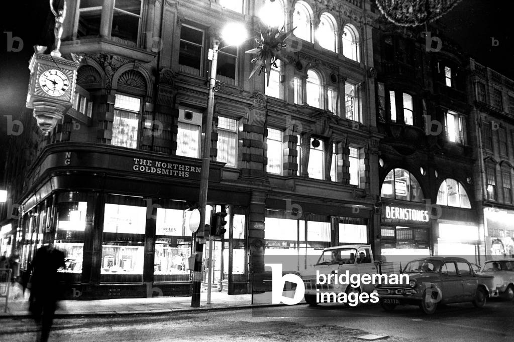 The Northern Goldsmiths shop on the corner of Pilgrim Street and Blackett Street, Newcastle City Centre at night 8th December 1970 (b/w photo)